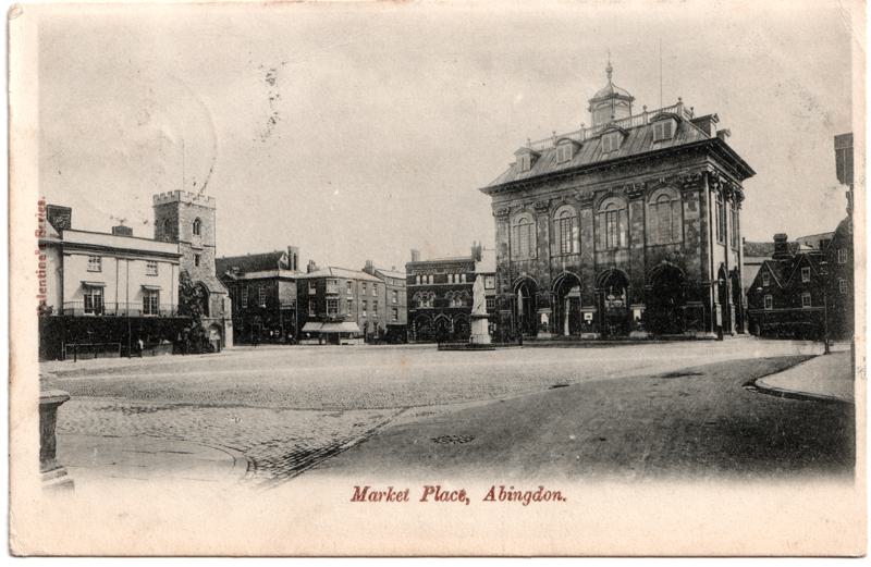 The front of an old postcard. The postcard is of Abingdon: Marketplace