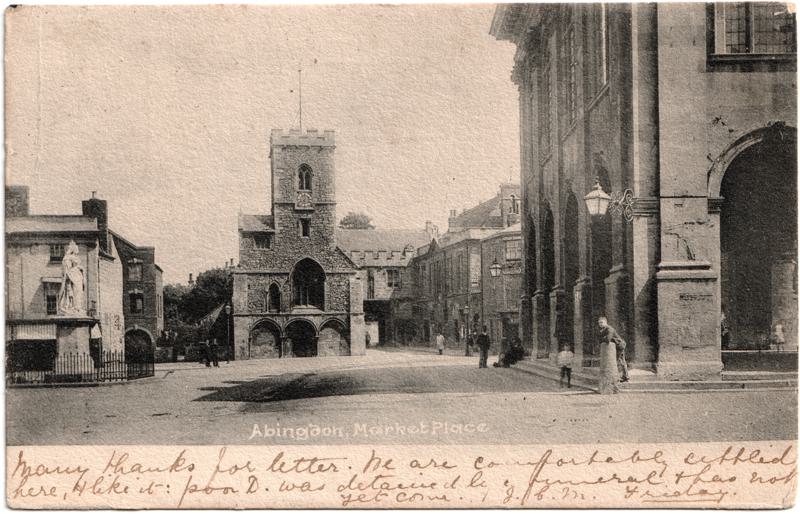 The front of an old postcard. The postcard is of Abingdon: Marketplace