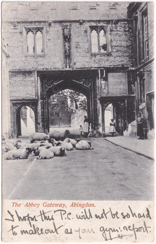 The front of an old postcard. The postcard is of Abingdon: Abbey Gateway