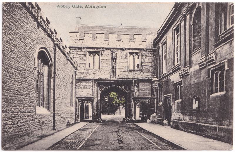 The front of an old postcard. The postcard is of Abingdon: Abbey Gateway