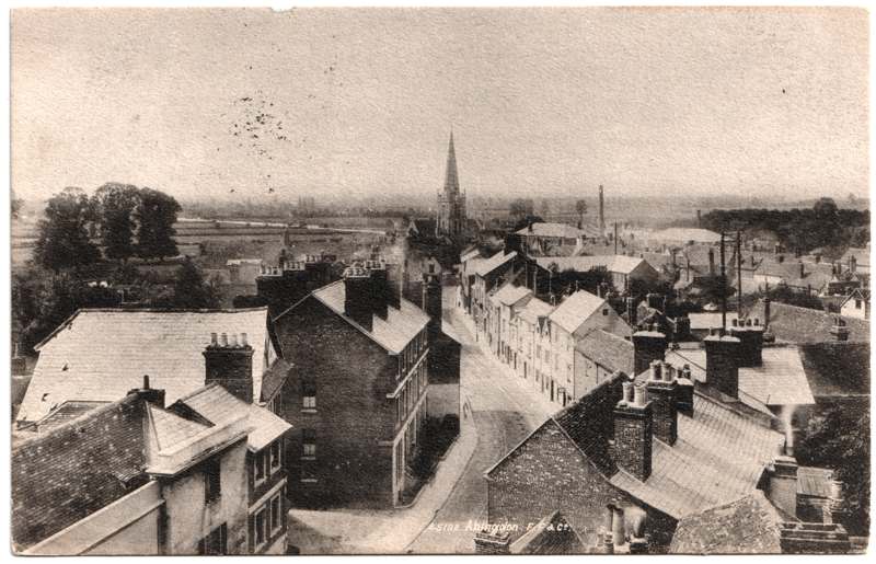 The front of an old postcard. The postcard is of Abingdon: Town Centre Streets