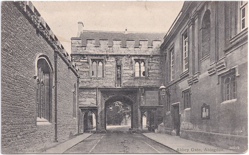 The front of an old postcard. The postcard is of Abingdon: Abbey Gateway