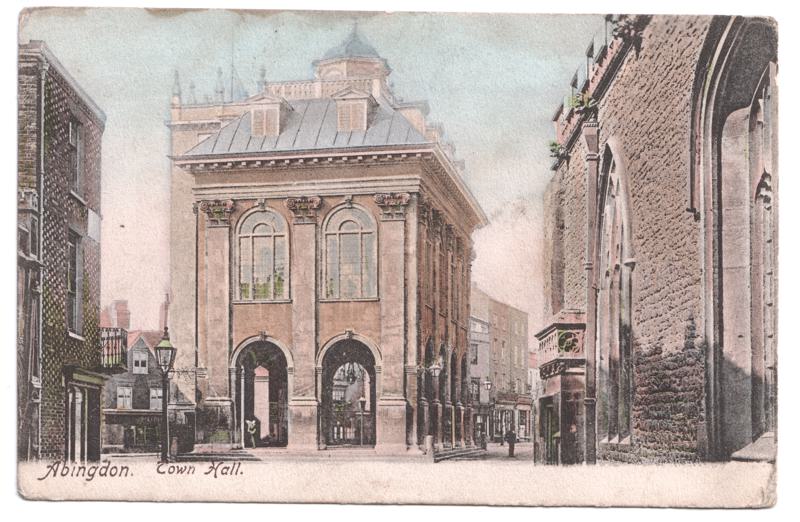 The front of an old postcard. The postcard is of Abingdon: Marketplace