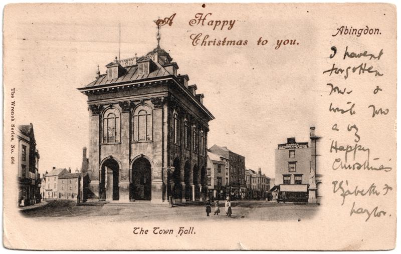 The front of an old postcard. The postcard is of Abingdon: Marketplace