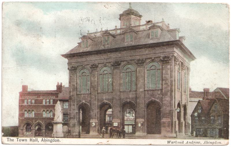 The front of an old postcard. The postcard is of Abingdon: Marketplace