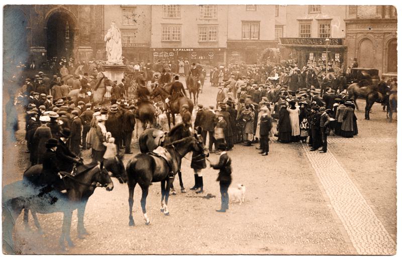 The front of an old postcard. The postcard is of Abingdon: Marketplace