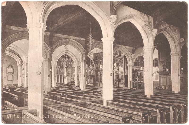 The front of an old postcard. The postcard is of Abingdon: St. Helen's Church and the Almshouses