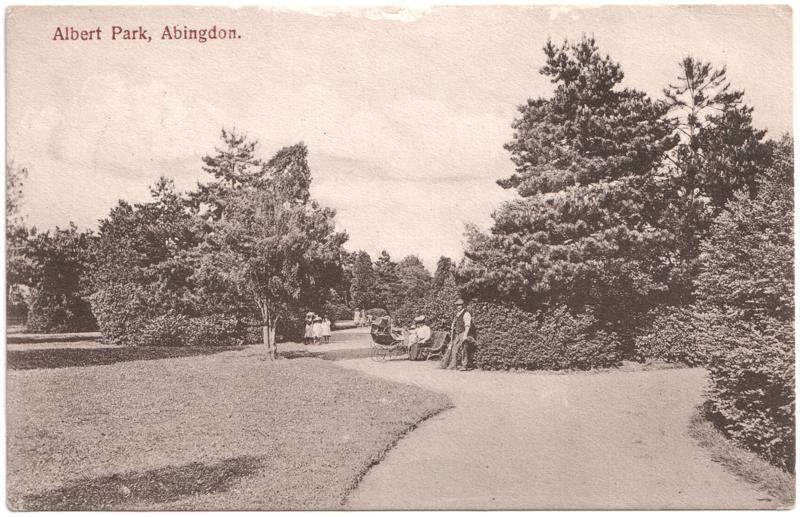 The front of an old postcard. The postcard is of Abingdon: Albert Park and Abingdon School