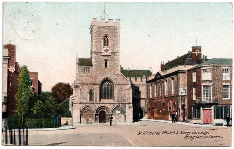 The front of an old postcard. The postcard is of Abingdon: Abbey Gateway