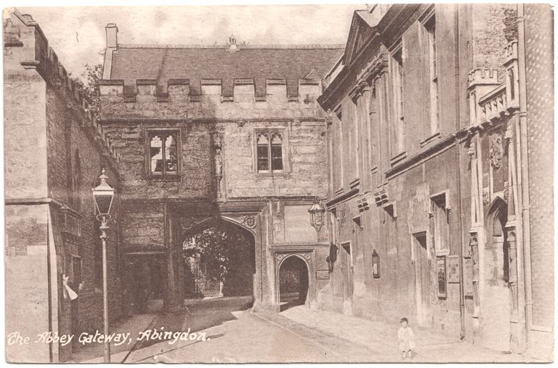 The front of an old postcard. The postcard is of Abingdon: Abbey Gateway