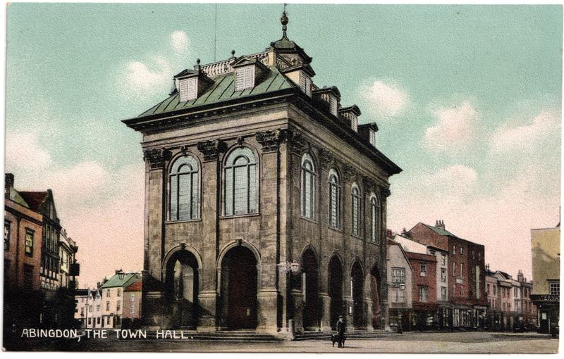 The front of an old postcard. The postcard is of Abingdon: Marketplace