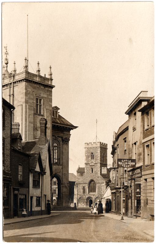 The front of an old postcard. The postcard is of Abingdon: Town Centre Streets