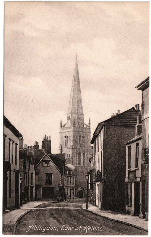 The front of an old postcard. The postcard is of Abingdon: Town Centre Streets
