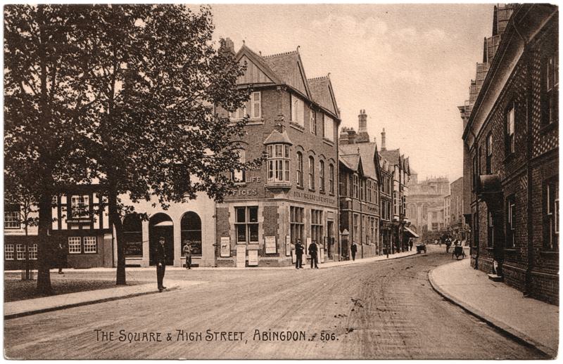 The front of an old postcard. The postcard is of Abingdon: Town Centre Streets