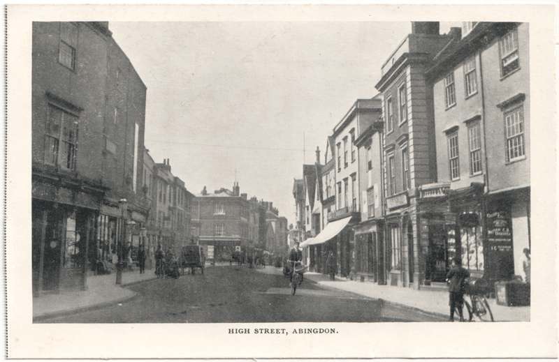 The front of an old postcard. The postcard is of Abingdon: Town Centre Streets