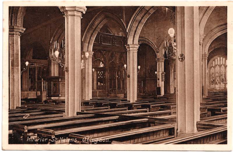 The front of an old postcard. The postcard is of Abingdon: St. Helen's Church and the Almshouses