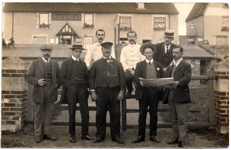 The front of an old postcard. The postcard is of Abingdon: The Bridge