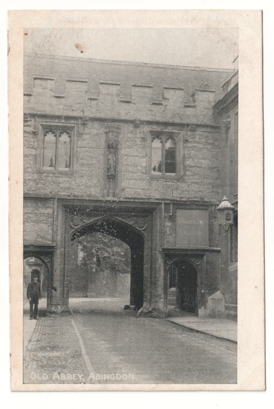 The front of an old postcard. The postcard is of Abingdon: Abbey Gateway