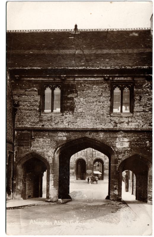 The front of an old postcard. The postcard is of Abingdon: Abbey Gateway