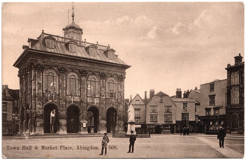 The front of an old postcard. The postcard is of Abingdon: Marketplace