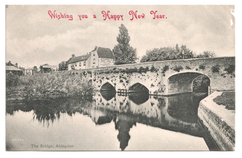 The front of an old postcard. The postcard is of Abingdon: The Bridge