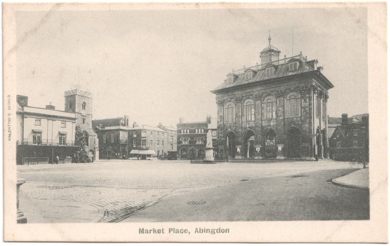 The front of an old postcard. The postcard is of Abingdon: Marketplace